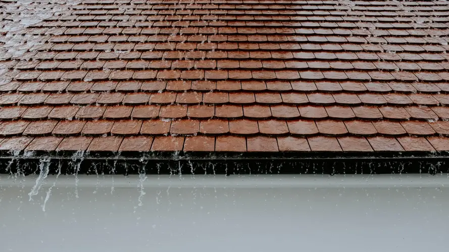 Rain falling on a red clay tiled roof during a storm in Long Beach