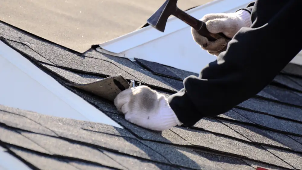 Roof renovation showing removed shingles and wooden framework beneath
