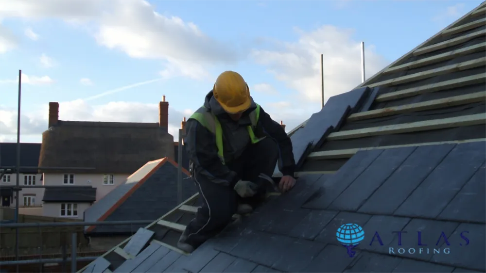 Licensed roofer working on residential roof in Long Beach
